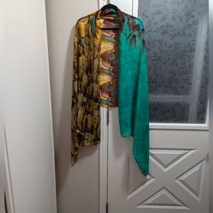 100% viscose, silk feel scarf. Chiffon like material. Feather pattern. Wrap.